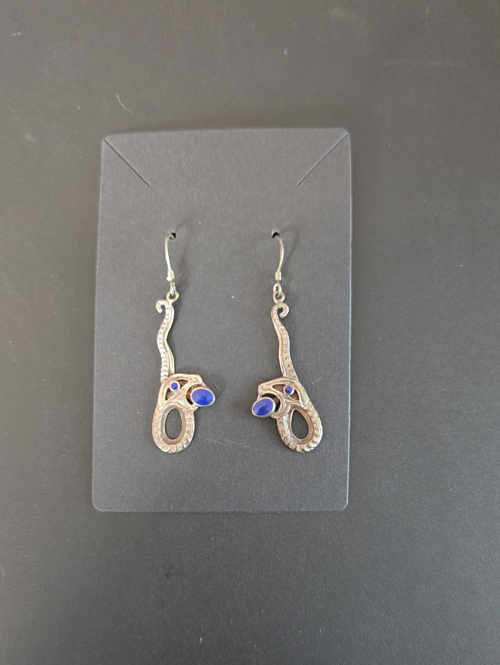 Silver Tone Serpent Drop Earrings with Blue Stone Accent